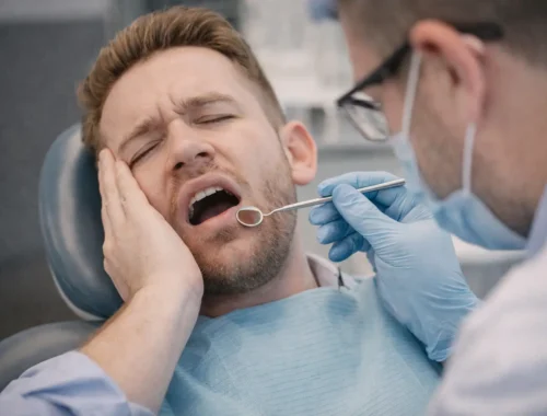 Patient with tooth pain during an emergency dental exam in Rexburg