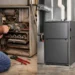 Technician comparing furnace repair and replacement options in a home